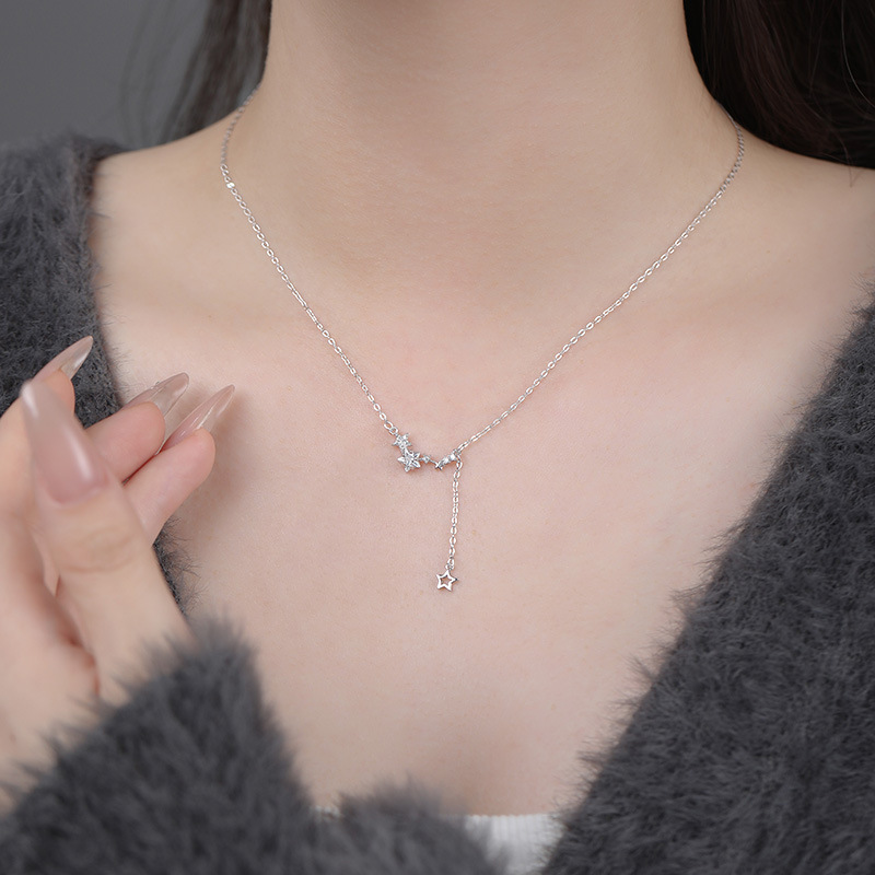 New summer delicate clavicle chain necklace with star tassel design for women.