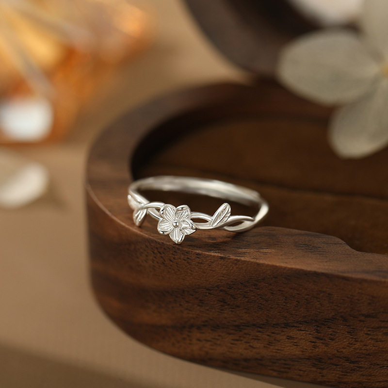 A sweet, simple, and uniquely designed floral ring; a fresh and delicate hand accessory.