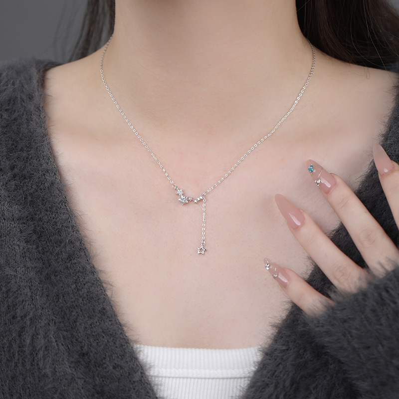 New summer delicate clavicle chain necklace with star tassel design for women.